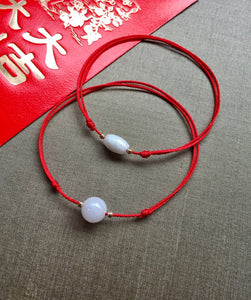 Lucky bead red hot sale string bracelet meaning